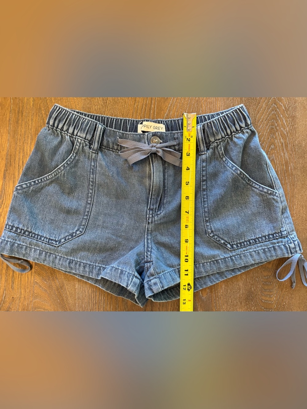 Stretch Waist w/ Button Denim Shorts, back & front pockets and tie details.